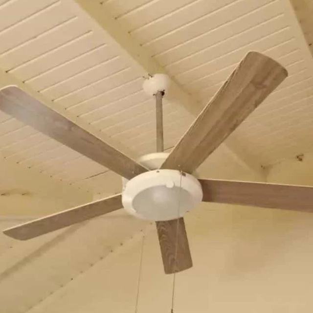 Ceiling fan installed on a wooden ceiling